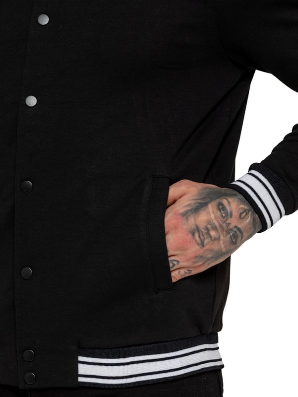 The Enzo Milano Men's Bomber Jacket combines classic style with modern comfort. Designed in a regular fit, it features a stretch fabric for ease of movement and all-day comfort. The contrast-tipped ribbed collar and cuffs add a stylish touch, while the popper fastening ensures easy wear. With two practical pockets and ribbed trims for a snug fit, this versatile jacket is perfect for any casual or smart-casual look.(35)
