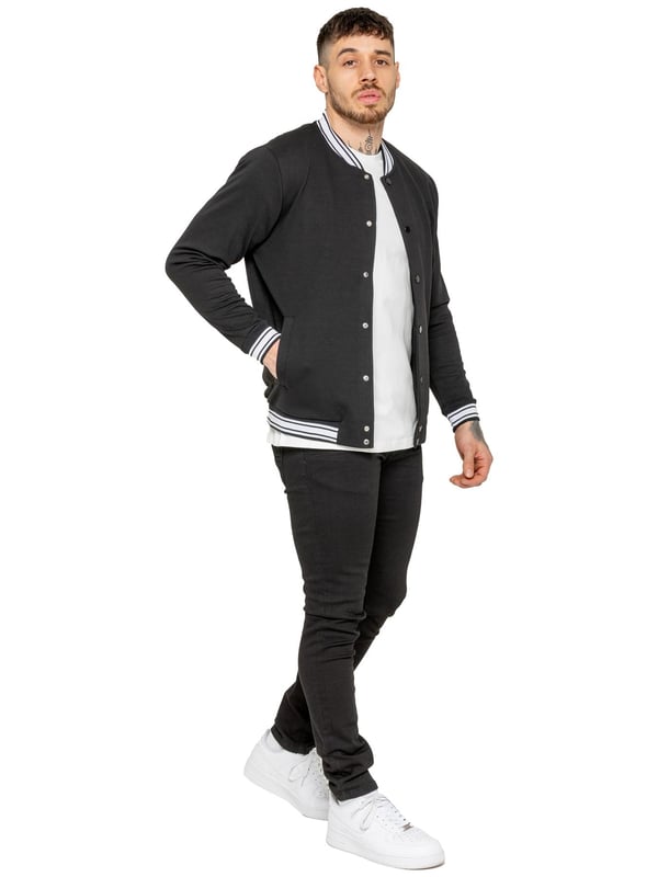 The Enzo Milano Men's Bomber Jacket combines classic style with modern comfort. Designed in a regular fit, it features a stretch fabric for ease of movement and all-day comfort. The contrast-tipped ribbed collar and cuffs add a stylish touch, while the popper fastening ensures easy wear. With two practical pockets and ribbed trims for a snug fit, this versatile jacket is perfect for any casual or smart-casual look.(35)