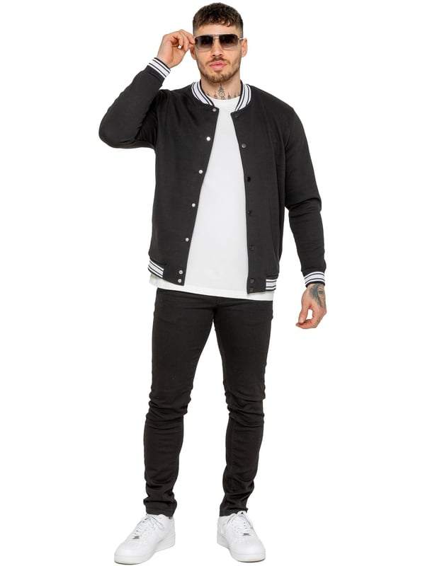 The Enzo Milano Men's Bomber Jacket combines classic style with modern comfort. Designed in a regular fit, it features a stretch fabric for ease of movement and all-day comfort. The contrast-tipped ribbed collar and cuffs add a stylish touch, while the popper fastening ensures easy wear. With two practical pockets and ribbed trims for a snug fit, this versatile jacket is perfect for any casual or smart-casual look.(35)