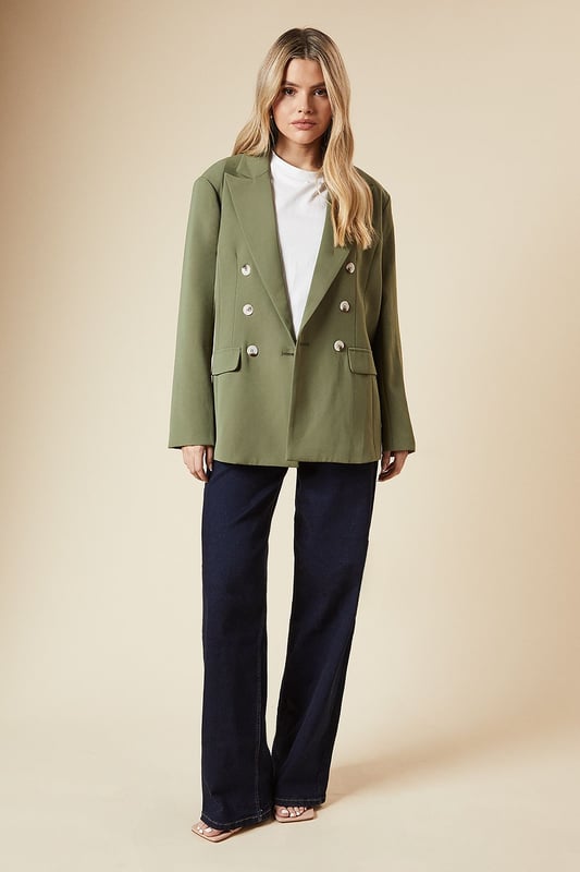 Oversized fit for a relaxed and comfortable silhouette
        Double-breasted design with stylish button detailing
        Notched lapel collar adds a classic touch
        Long sleeves with subtle shoulder padding for structure
        Versatile woven fabric suitable for various occasions
    
    Embrace effortless sophistication with this oversized double-breasted blazer from Dorothy Perkins. Perfect for the fashion-forward woman in her 30s who appreciates a blend of trend and comfort. The relaxed fit allows for easy layering over your favourite tops, while the classic double-breasted front presents a polished look. Style it with wide-leg jeans and trainers for a chic brunch ensemble, or throw it over a midi dress for a baby shower. The versatile nature of this blazer makes it an ideal choice for family gatherings and casual outings. Its neutral tone ensures it pairs well with various colours in your wardrobe. For a trendy twist, roll up the sleeves and add some statement jewellery. This blazer is your go-to piece for elevating everyday looks with minimal effort.
