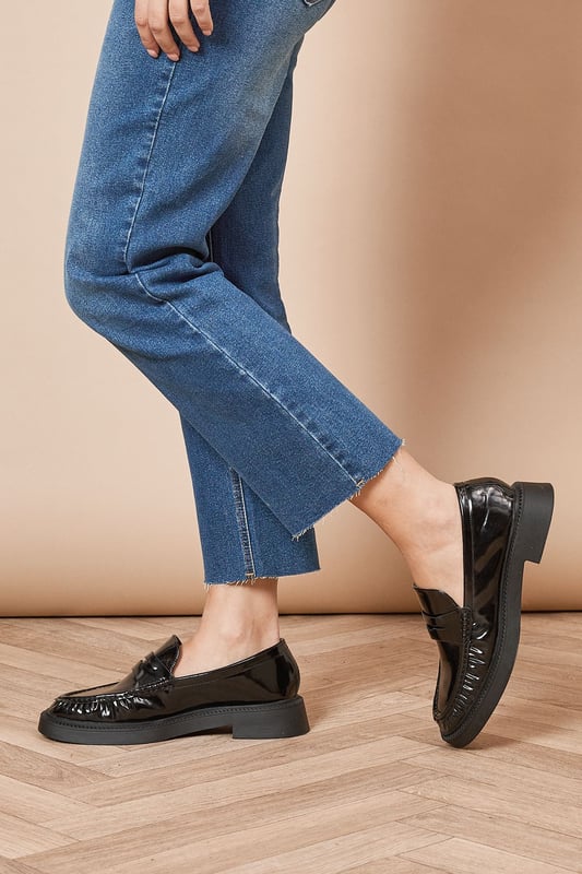 Faux patent leather upper for a glossy, polished look
        Chunky sole design for added height and comfort
        Classic loafer silhouette with a modern twist
        Flat heel between 0 and 2cm for all-day wearability
        Versatile neutral tone suitable for various outfits
    
    Step out in style with the Faith Helia Faux Patent Leather Chunky Loafers, a perfect blend of classic design and contemporary flair. These eye-catching flats boast a sleek, glossy finish that adds a touch of sophistication to any ensemble. The chunky sole not only provides a subtle height boost but also ensures comfort for extended wear. Ideal for the fashion-forward individual, these loafers can effortlessly transition from day to night. Pair them with cropped jeans and a crisp white shirt for a chic daytime look, or style them with a flowing midi dress for a more relaxed evening outfit. Whether you're heading to a casual lunch date, running errands, or meeting friends for coffee, these versatile loafers will keep you looking polished and feeling comfortable throughout your day.
