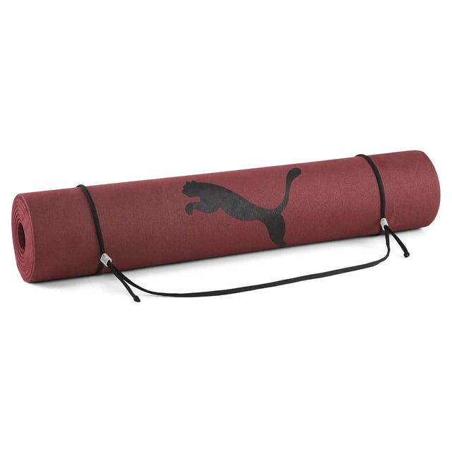 The Puma Logo Burgundy Yoga Mat is the perfect blend of comfort, durability, and style for your yoga practice. Designed for both beginners and experienced practitioners, this mat offers a high-quality surface for all types of exercises, from yoga and Pilates to general fitness routines. With its rich burgundy color and iconic Puma branding, this mat adds a touch of sporty elegance to your workout space.
Key Features:
Premium Non-Slip Surface: 

The non-slip surface ensures stability and safety during your practice, providing a firm grip on the floor and preventing the mat from sliding around, no matter how intense your session gets.


Comfort &amp; Cushioning: 

The mat is designed with thick, cushioned foam to provide support for your joints and spine, making it comfortable for floor exercises, stretches, and poses.


Durable &amp; Long-Lasting: 

Crafted with high-quality, durable materials, this yoga mat is built to withstand regular use, maintaining its shape and functionality over time.


Easy to Clean: 

The smooth, easy-to-clean surface ensures maintenance is a breeze, keeping your mat fresh and hygienic for every workout.


Compact &amp; Lightweight: 

The lightweight design allows for easy portability, making it simple to carry to the gym, studio, or anywhere you practice yoga.


Puma Branding: 

The iconic Puma logo is prominently displayed, adding a touch of athletic style and quality to your yoga essentials.


Stylish Burgundy Color: 

The rich burgundy color adds a vibrant yet sophisticated touch to your workout gear, making it a stylish choice for any fitness enthusiast.


The Puma Logo Burgundy Yoga Mat combines functionality, comfort, and design, making it the perfect addition to your fitness routine. Whether you're focusing on yoga, stretching, or general workouts, this mat offers the support and style you need to enhance your practice.