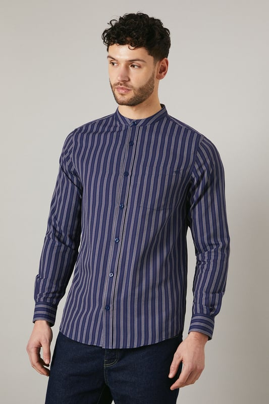 Distinctive grandad collar for a modern twist
        Vertical stripes create a slimming effect
        Long sleeves with button cuffs for versatility
        Convenient chest pocket for small essentials
        Relaxed fit for all-day comfort
    
    This Maine grandad collar shirt offers a contemporary take on casual style. The vertical stripes elongate the silhouette, while the relaxed fit ensures comfort for various body types. Perfect for laid-back weekends or casual Fridays at the office, this shirt can be styled effortlessly with dark denim jeans and white trainers for a smart-casual look. Layer it under a lightweight jacket for cooler evenings or wear it open over a plain t-shirt for a more relaxed vibe. The versatile design makes it suitable for family gatherings, pub outings with mates, or casual dates. The grandad collar adds a touch of sophistication, allowing you to dress it up with chinos and loafers for semi-formal occasions. Easy to care for and comfortable to wear, this shirt is set to become a staple in your wardrobe, offering endless styling possibilities for the modern British gent.
