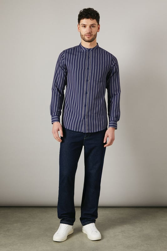 Distinctive grandad collar for a modern twist
        Vertical stripes create a slimming effect
        Long sleeves with button cuffs for versatility
        Convenient chest pocket for small essentials
        Relaxed fit for all-day comfort
    
    This Maine grandad collar shirt offers a contemporary take on casual style. The vertical stripes elongate the silhouette, while the relaxed fit ensures comfort for various body types. Perfect for laid-back weekends or casual Fridays at the office, this shirt can be styled effortlessly with dark denim jeans and white trainers for a smart-casual look. Layer it under a lightweight jacket for cooler evenings or wear it open over a plain t-shirt for a more relaxed vibe. The versatile design makes it suitable for family gatherings, pub outings with mates, or casual dates. The grandad collar adds a touch of sophistication, allowing you to dress it up with chinos and loafers for semi-formal occasions. Easy to care for and comfortable to wear, this shirt is set to become a staple in your wardrobe, offering endless styling possibilities for the modern British gent.