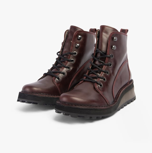 Fly London HAZI147FLY Womens Boots Wine Upper Material: LeatherLining Material: MicrofibreSole Material: RubberClosure/Fastening: Lace-UpFeatures: Comfort,BreathableHeel Type: BlockToe Shape: RoundShoe Width: RegularItem Weight: 0.45 KGHeel Height: Medium (5-7.4cm)Shoe Shaft Height: AnkleBoot Style: Ankle BootsGift Boxed: NoProduct Code: P211147005