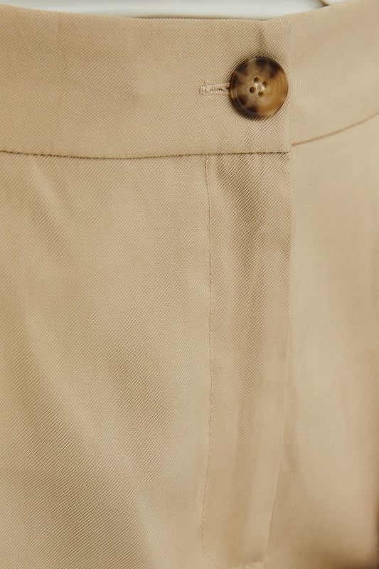 Elegant straight leg design for a timeless silhouette
        Pleated front detail adds sophistication and structure
        Wide waistband for a comfortable and flattering fit
        Side pockets for practicality and style
        Versatile length suitable for various shoe choices
    
    These straight leg pleated trousers from Wallis are the epitome of effortless chic. Perfect for the woman who values both comfort and style, they offer a sophisticated look for various daytime occasions. The pleated front adds a touch of refinement, while the straight leg cut ensures a flattering fit for all body types. Style these trousers with a crisp white blouse and ballet flats for a polished look at family gatherings, or pair with a soft knit jumper and loafers for a smart-casual ensemble ideal for lunch with friends. The versatile design makes these trousers a wardrobe staple, easily transitioning from a day at the office to weekend brunches. Accessorise with a statement necklace and a structured tote to complete your look with Wallis' signature glamour.