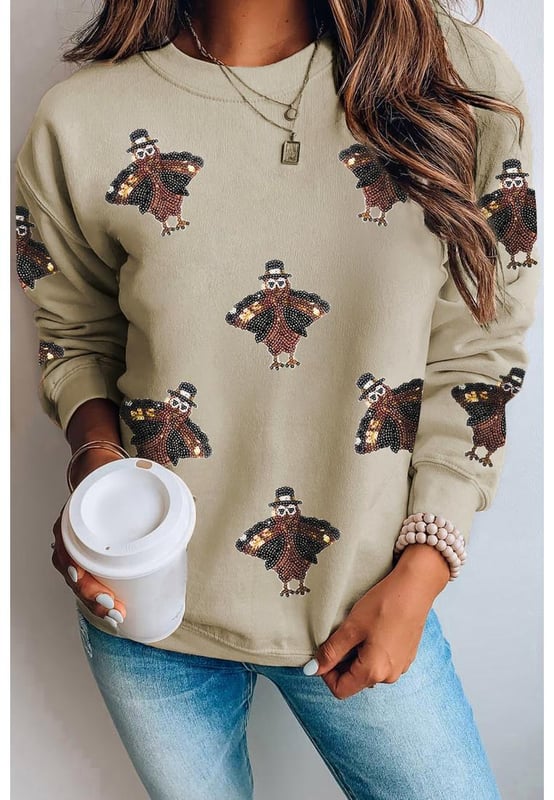 Shimmering Turkey Pattern Thanksgiving Holiday Sweatshirt
  Comfortable choice for the winter
  Perfect for Thanksgiving celebrations or cozy nights in
  Crew neck design
  Shift fit suitable for all
  day wear
  Pairs well with jeans or casual pants
  Ideal for staying stylish in autumn months
Material: 50% Polyester 50% Cotton