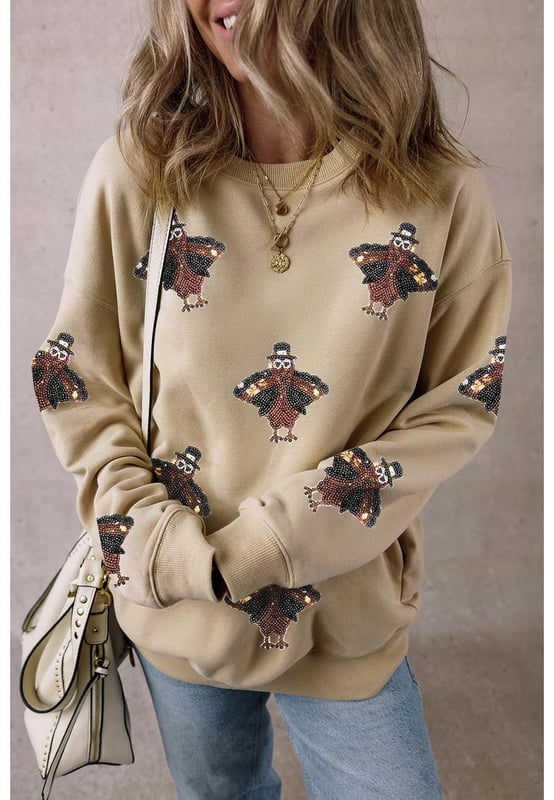 Shimmering Turkey Pattern Thanksgiving Holiday Sweatshirt
  Comfortable choice for the winter
  Perfect for Thanksgiving celebrations or cozy nights in
  Crew neck design
  Shift fit suitable for all
  day wear
  Pairs well with jeans or casual pants
  Ideal for staying stylish in autumn months
Material: 50% Polyester 50% Cotton