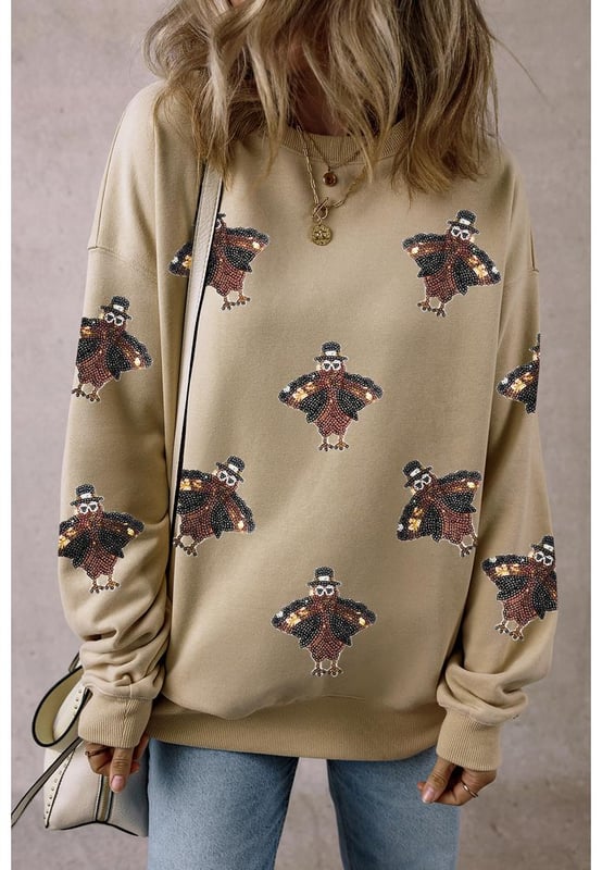 Shimmering Turkey Pattern Thanksgiving Holiday Sweatshirt
  Comfortable choice for the winter
  Perfect for Thanksgiving celebrations or cozy nights in
  Crew neck design
  Shift fit suitable for all
  day wear
  Pairs well with jeans or casual pants
  Ideal for staying stylish in autumn months
Material: 50% Polyester 50% Cotton
