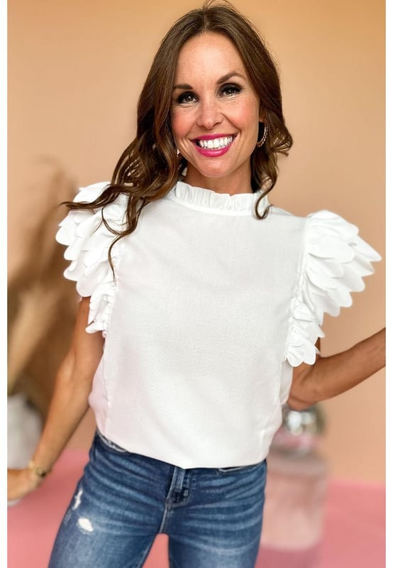 White solid color top
  Scalloped ruffle sleeves add volume and dimension to your arms
  Frilled neck adds a charming and romantic touch to the overall design
  Solid color offers versatility and easy coordination with various bottoms and accessories
  Timeless and polished look that can be dressed up or down for any occasion
  Unisex top comes in different sizes
Material: 100% Polyester