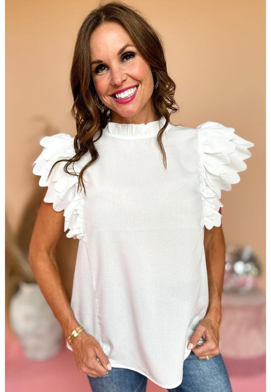 White solid color top
  Scalloped ruffle sleeves add volume and dimension to your arms
  Frilled neck adds a charming and romantic touch to the overall design
  Solid color offers versatility and easy coordination with various bottoms and accessories
  Timeless and polished look that can be dressed up or down for any occasion
  Unisex top comes in different sizes
Material: 100% Polyester