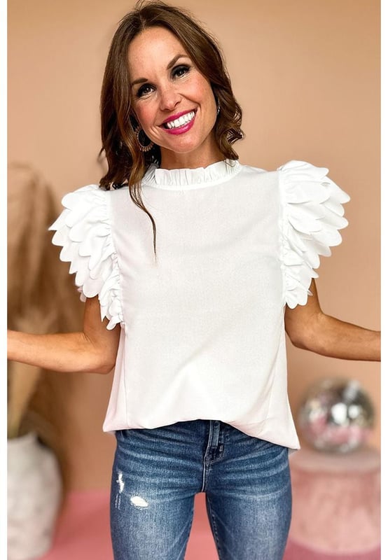 White solid color top
  Scalloped ruffle sleeves add volume and dimension to your arms
  Frilled neck adds a charming and romantic touch to the overall design
  Solid color offers versatility and easy coordination with various bottoms and accessories
  Timeless and polished look that can be dressed up or down for any occasion
  Unisex top comes in different sizes
Material: 100% Polyester