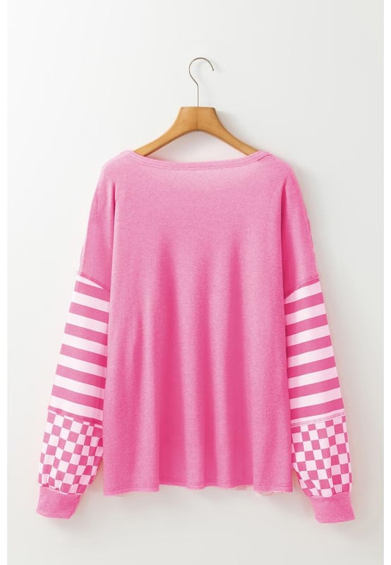 Distinctive checkerboard and striped mixed pattern
  Unique patchwork details
  Voluminous lantern sleeves for a dramatic flair
  High
  low hem and chest pocket for added detail
  Comfortable fit for casual and daily wear
Material: 100% Polyester