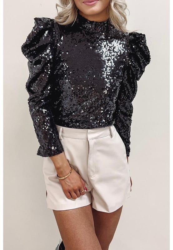 Black Sequin Mock Neck Bubble Sleeve Top
  Sleek black color with sequin embellishments
  Contemporary mock neck design
  Playful bubble sleeves
  Made from high
  quality materials
  Suitable for both men and women
  Versatile piece for various occasions