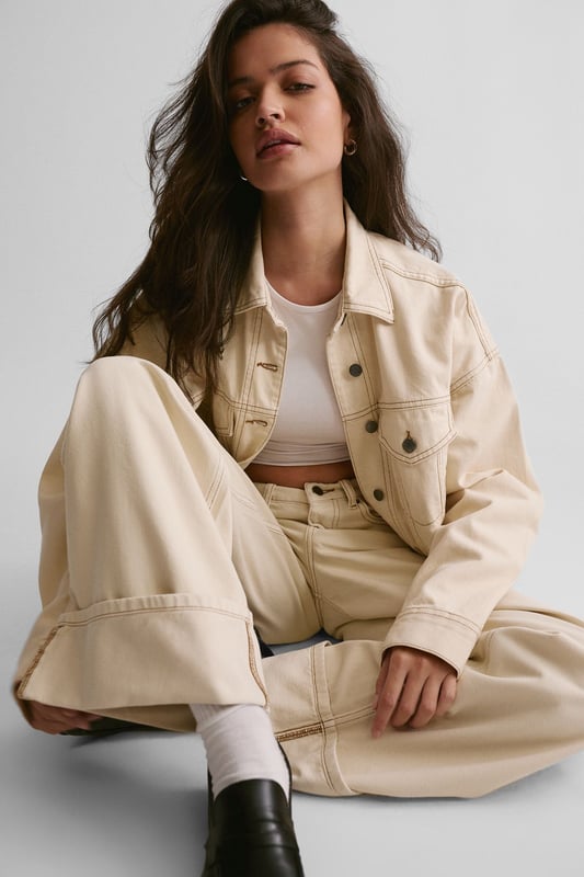 Boxy, oversized fit for a relaxed and trendy silhouette
        Classic denim construction with sturdy button-up front
        Functional chest pockets for added utility and style
        Versatile design suitable for layering over various outfits
        Timeless collar detail for a polished finish
    
    The Oversized Denim Jacket from NastyGal is a wardrobe essential that effortlessly combines comfort with style. This boxy-fit jacket offers a contemporary twist on a classic design, perfect for those seeking a relaxed yet fashionable look. The versatile nature of this piece allows for endless styling possibilities, making it a go-to choice for casual outings and laid-back events. Pair it with wide-leg trousers and chunky trainers for a trendy daytime ensemble, or throw it over a midi dress for a chic contrast at family gatherings. The jacket's roomy silhouette makes it ideal for layering over jumpers during cooler months, while its timeless appeal ensures it will remain a staple in your wardrobe for seasons to come. Whether you're heading to a casual brunch or a relaxed evening with friends, this NastyGal denim jacket will add an effortless cool to any outfit.