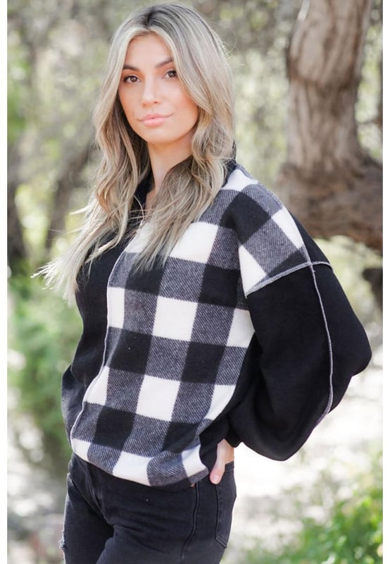 Unisex Black Checkboard Patchwork Exposed Stitching Collared Top
  Features a unique black checkboard patchwork design
  Exposed stitching adds edginess to the design
  Made from high
  quality materials
  Versatile piece that can be worn for both formal and casual occasions