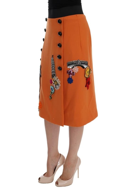 Precioso a estrenar con etiquetas.
  Hecho en Italia.
  Material 100% lana virgen.
  Color naranja con adornos multicolores.
  Torre Strass Pisa y aplique de la estatua de Appolo.
  Flores de cristal seda y cosidas.
  Forro elastico de seda.
  Cierre de crema.
