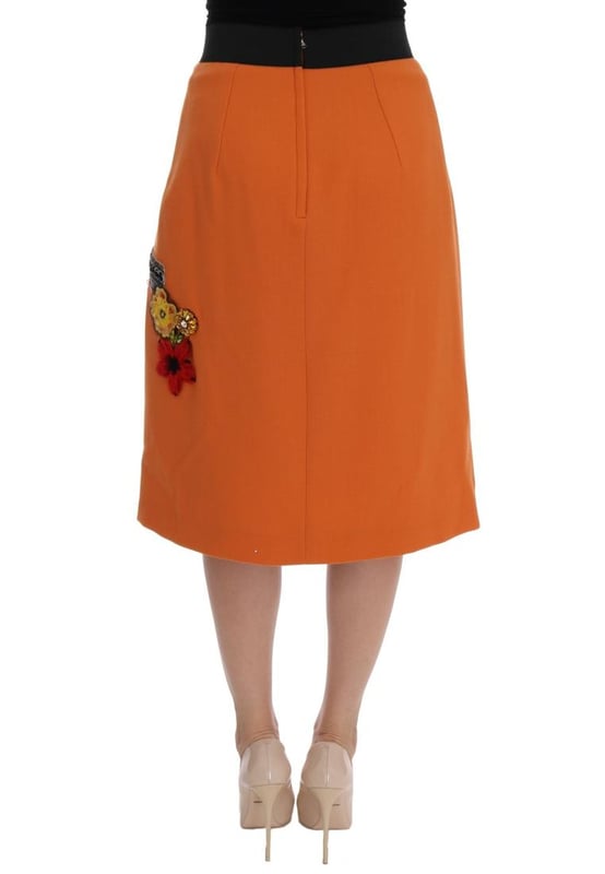 Precioso a estrenar con etiquetas.
  Hecho en Italia.
  Material 100% lana virgen.
  Color naranja con adornos multicolores.
  Torre Strass Pisa y aplique de la estatua de Appolo.
  Flores de cristal seda y cosidas.
  Forro elastico de seda.
  Cierre de crema.