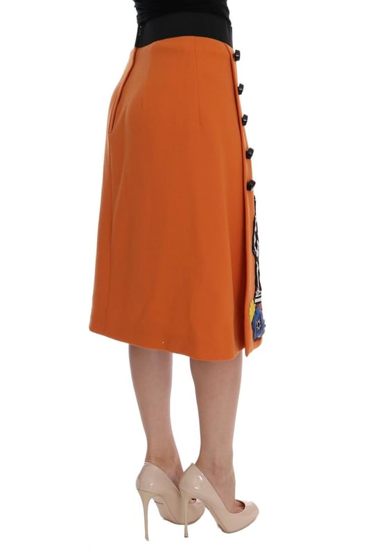 Precioso a estrenar con etiquetas.
  Hecho en Italia.
  Material 100% lana virgen.
  Color naranja con adornos multicolores.
  Torre Strass Pisa y aplique de la estatua de Appolo.
  Flores de cristal seda y cosidas.
  Forro elastico de seda.
  Cierre de crema.