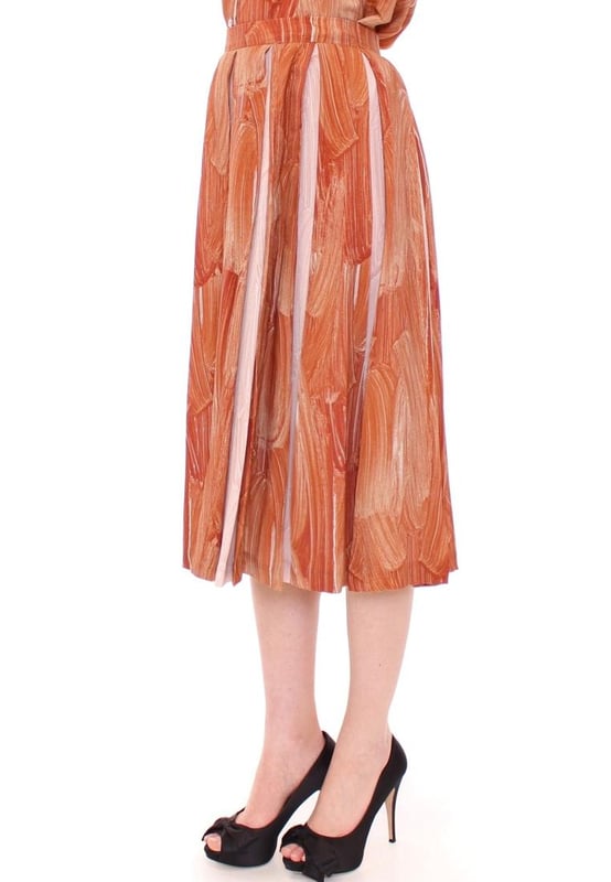 Marca: Licia Florio.
  Estilo: Falda amplia.
  Color: Marron anaranjado.
  Longitud: Por debajo de la rodilla.
  Cierre: Apertura con cremallera en la parte trasera.
  Detalles: Detalles del logotipo.
  Material: 100% Viscosa.
  Hecho en Italia.
  Genero: Mujer.