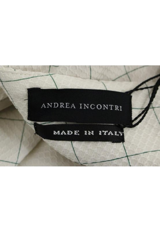 Marca: Andrea Incontri.
  Estilo: Falda lapiz.
  Color: Blanco.
  Longitud: hasta la rodilla.
  Cierre: Bragueta con cremallera trasera.
  Detalles del logotipo.
  Hecho en Italia.
  Material: 100% algodon.
