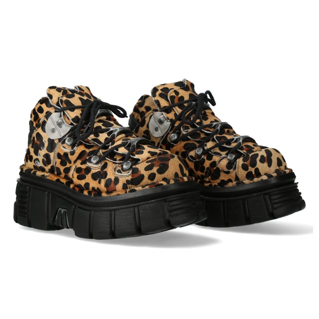 The M-106-C192 from New Rock’s Classic Collection combines a bold urban heavy rock aesthetic with premium craftsmanship. These unisex ankle boots feature a striking brown leapord-print cow leather upper, metal lace hooks, and the brand’s iconic PU-ULTRA platform sole for superior durability and an elevated look.

Key Features:
Material: Outer - Leopard-Print Cow Leather | Inner - Calf Skin
Sole Material: PU-ULTRA | Fixing System: Glued & Sewn
Fastening: Lace-up (Cord)
Heel Height: 6 cm | Platform Height: 4 cm
Shaft Height: 11 cm
Style: Urban, Heavy, Rock, Stylish
Unisex Design: Suitable for all genders