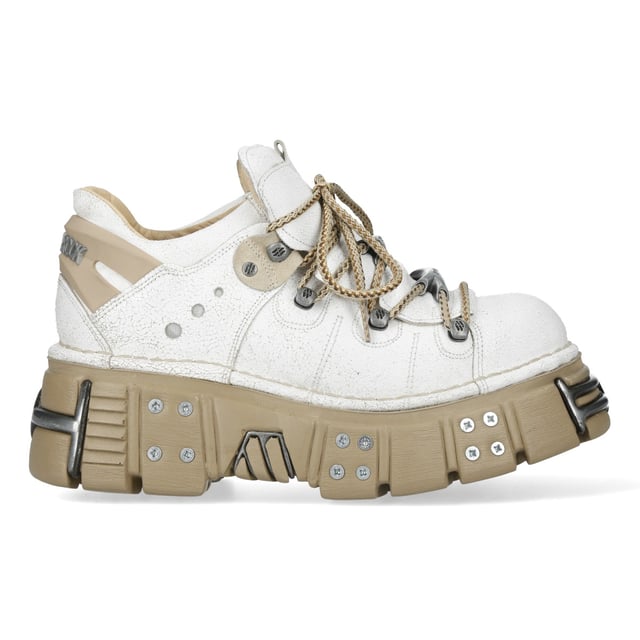 Los zapatos New Rock M-120N-C80 de la Colección Metallic combinan la estética gótica y punk con un toque futurista. Fabricados en material sintético de alta calidad con interior de piel de cerdo, ofrecen durabilidad y comodidad. Con un llamativo tacón de plataforma de 7 cm y una suela de 4 cm, estos zapatos ofrecen un look sofisticado y llamativo. El diseño con cordones refuerza su carácter rebelde, haciéndolos perfectos para quienes adoptan la moda alternativa con un toque moderno. Características principales: Material: Exterior - Sintético | Interior - Piel de cerdo | Altura del tacón: 7 cm | Altura de la plataforma: 4 cm | Material de la suela: PU-ULTRA | Cierre: Cordones (cordón) | Altura de la caña: 10 cm | Estilo: Gótico, Heavy, Punk, Rock | Diseño unisex: Adecuados tanto para hombre como para mujer | Color único: Exterior blanco llamativo con suela beige para un look impactante