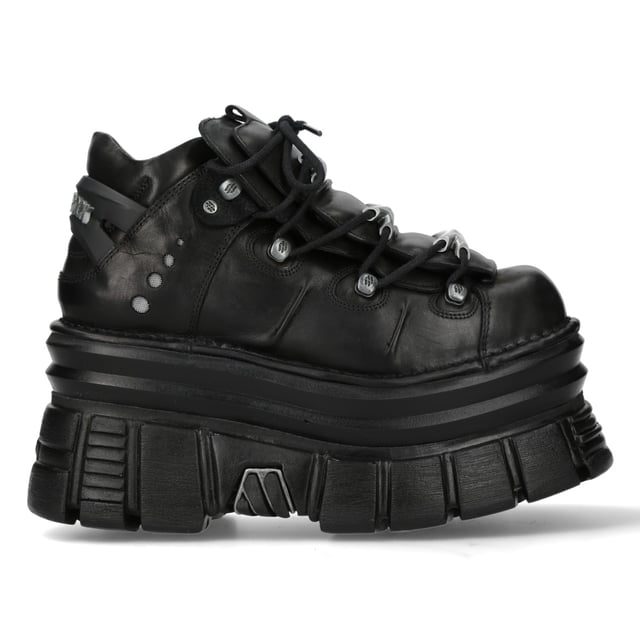 New Rock M-106-C178 Black Tower Gothic Punk Chunky Ankle Boots The New Rock M-106-C178 ankle boots from the Metallic Collection embody gothic and punk rebellion with a bold, high-platform design. Made from premium black cow leather with a pigskin interior, they offer both durability and comfort. Featuring an 11 cm heel and 8 cm platform, these boots provide an elevated stance with a commanding presence. The lace-up closure enhances their classic rock aesthetic, making them an essential piece for those who embrace alternative fashion.
Key Features:
Material: Outer - Cow Leather | Inner - Pigskin
Heel Height: 11 cm | Platform Height: 8 cm
Sole Material: PU-ULTRA
Fastening: Laces (Cord)
Shaft Height: 10 cm
Style: Gothic, Heavy, Punk, Rock
Unisex Design: Suitable for all genders