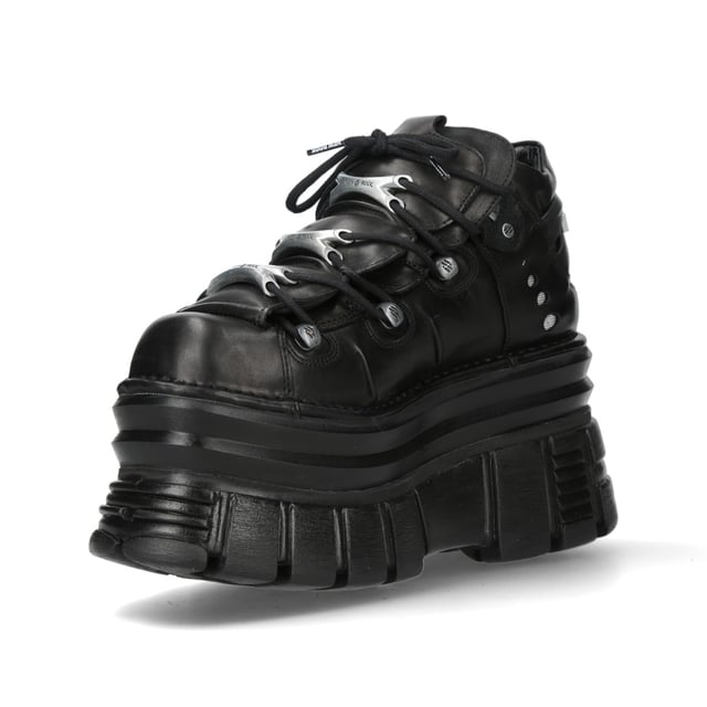 New Rock M-106-C178 Black Tower Gothic Punk Chunky Ankle Boots The New Rock M-106-C178 ankle boots from the Metallic Collection embody gothic and punk rebellion with a bold, high-platform design. Made from premium black cow leather with a pigskin interior, they offer both durability and comfort. Featuring an 11 cm heel and 8 cm platform, these boots provide an elevated stance with a commanding presence. The lace-up closure enhances their classic rock aesthetic, making them an essential piece for those who embrace alternative fashion.
Key Features:
Material: Outer - Cow Leather | Inner - Pigskin
Heel Height: 11 cm | Platform Height: 8 cm
Sole Material: PU-ULTRA
Fastening: Laces (Cord)
Shaft Height: 10 cm
Style: Gothic, Heavy, Punk, Rock
Unisex Design: Suitable for all genders