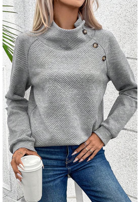 Gray high neck sweatshirt
  Asymmetric button detailing on the front
  Textured fabric with a soft feel
  Versatile for casual and formal occasions
Material: 95% Polyester 5% Elastane