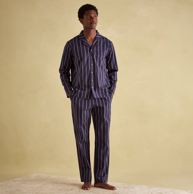 Joules Joules HUGO Mens Pyjama Set Navy Stripe

Closure/Fastening: Button,Pull-On

Features: Comfort

Item Weight: 0.4 KG

Clothing Fit: Regular

Single Or Multi Pack?: Single

Gift Boxed: No

Material Composition: 100% Cotton

Clothing Features: Single Chest Pocket | Piped Trims | Elasticated Waist | Drawstring Ties | Branded Tab on Waistband
Product Code: 372828-NVYSTRP