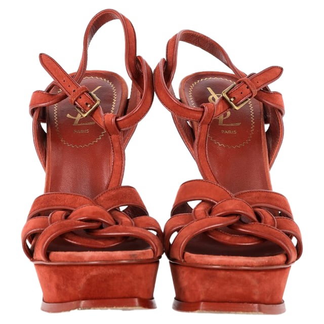 VINTAGE, RRP AS NEW
Saint Laurent Tribute Sandals in Burgundy Suede – Luxe Elegance with a Pop of Color
Step into effortless elegance with the Saint Laurent Tribute Sandals in Burgundy Suede. Crafted from supple suede, these sandals feature a striking burgundy hue that adds a sophisticated pop of color to any outfit. The sleek, strappy design and sturdy heel offer both comfort and style, making them the perfect choice for both casual and more elevated occasions. From day outings to evening events, these sandals add a touch of luxury to any ensemble.

Styling Tip: Pair these sandals with a flowy midi dress for an elegant yet playful look, or wear with a tailored mini skirt and blouse for a chic evening outfit. Add gold jewelry and a clutch to complete the sophisticated vibe.

Saint Laurent Tribute Sandals in Burgundy Suede
Condition: Good
Signs of wear: Moderate signs of wear or markings, moderate scuffing insoles., Used but well maintained. Moderate creasing and marks at surface, wear at soles or replaced soles. marks at toes
Packaging: None
Color: Red | burgundy
Material: Suede
Size: IT | 39
Measurements: Heel height: 130; Insole length: 270
SKU: NAPPUGBSH461662W