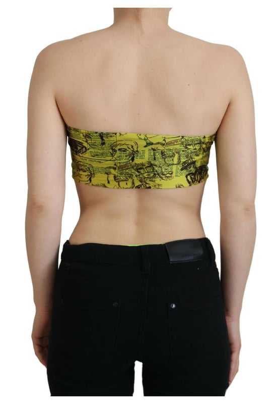 Marca: GALLIANO  
Top cropped sin mangas  
Color: Amarillo con estampado gráfico  
Hecho en Italia  
Materiales: 80% Nailon 20% Elastano