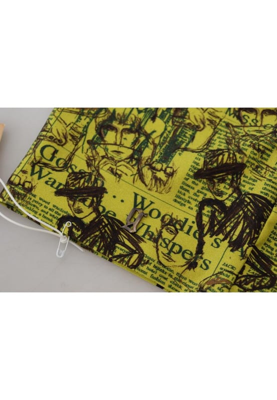 Marca: GALLIANO  
Top cropped sin mangas  
Color: Amarillo con estampado gráfico  
Hecho en Italia  
Materiales: 80% Nailon 20% Elastano