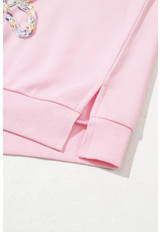 Fashionable pullover sweatshirt for casual wear
  Light pink color with embroidered bows for a feminine flair
  Lantern sleeves and oversized fit for a voluminous look
  Can be paired with jeans or denim shorts
  Ideal for everyday wear
Material: 65% Polyester 35% Cotton