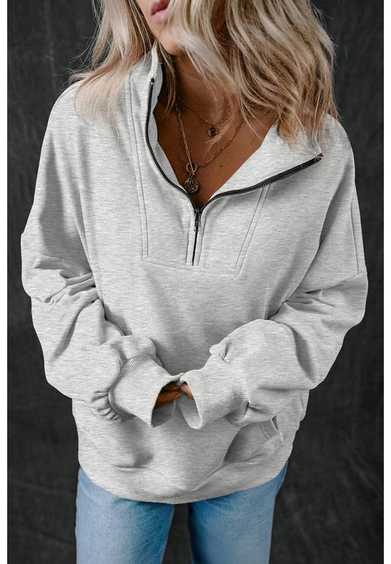 Casual sweatshirt in solid light grey color
  Zip
  up stand neck for a modern and comfortable fit
  Deep side
  entry kangaroo pockets for secure storage and hand warmth
  Textured and durable fabric for quality and comfort
  Focus on comfort and functionality
Material: 50% Polyester 50% Cotton