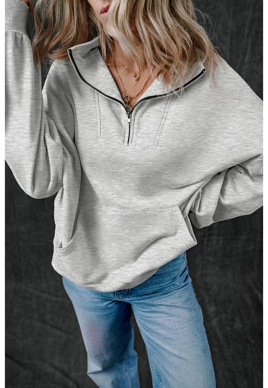 Casual sweatshirt in solid light grey color
  Zip
  up stand neck for a modern and comfortable fit
  Deep side
  entry kangaroo pockets for secure storage and hand warmth
  Textured and durable fabric for quality and comfort
  Focus on comfort and functionality
Material: 50% Polyester 50% Cotton