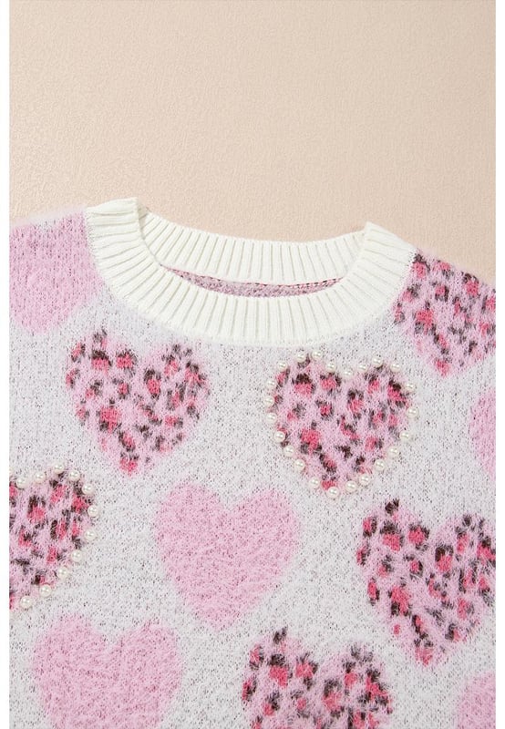 Corazón romántico con forma de corazón y estampado de leopardo  
Detalles perlados para un brillo adicional  
Diseño con ribetes para mayor estructura  
Material suave y acogedor para calidez  
Alta elasticidad