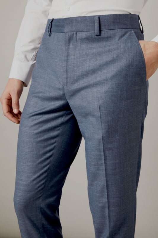 Slim fit design for a modern, tailored silhouette
        Versatile semi-plain fabric suitable for various occasions
        Belt loops for optional accessorising
        Crisp centre crease for a polished look
        Tapered leg ending just above the shoe
    
    These Burton slim fit trousers offer a contemporary twist on classic tailoring, perfect for the discerning gent who appreciates both style and comfort. The semi-plain fabric adds subtle texture, making these trousers a versatile choice for smart-casual events or more formal occasions. Pair them with a crisp white shirt and matching jacket for a sophisticated office ensemble, or dress them down with a polo shirt for after-work drinks at the local pub. The tapered leg creates a sleek silhouette that complements both oxfords and brogues, while the belt loops allow for personalised styling. Whether you're heading to a business meeting or enjoying a weekend outing, these trousers will ensure you look effortlessly put-together. Their adaptable nature makes them an essential addition to any modern man's wardrobe, seamlessly transitioning from day to night with ease.