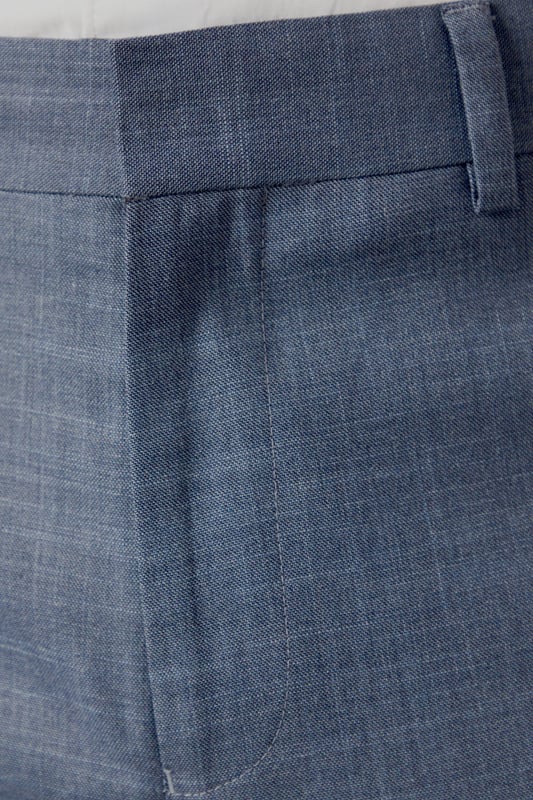 Slim fit design for a modern, tailored silhouette
        Versatile semi-plain fabric suitable for various occasions
        Belt loops for optional accessorising
        Crisp centre crease for a polished look
        Tapered leg ending just above the shoe
    
    These Burton slim fit trousers offer a contemporary twist on classic tailoring, perfect for the discerning gent who appreciates both style and comfort. The semi-plain fabric adds subtle texture, making these trousers a versatile choice for smart-casual events or more formal occasions. Pair them with a crisp white shirt and matching jacket for a sophisticated office ensemble, or dress them down with a polo shirt for after-work drinks at the local pub. The tapered leg creates a sleek silhouette that complements both oxfords and brogues, while the belt loops allow for personalised styling. Whether you're heading to a business meeting or enjoying a weekend outing, these trousers will ensure you look effortlessly put-together. Their adaptable nature makes them an essential addition to any modern man's wardrobe, seamlessly transitioning from day to night with ease.