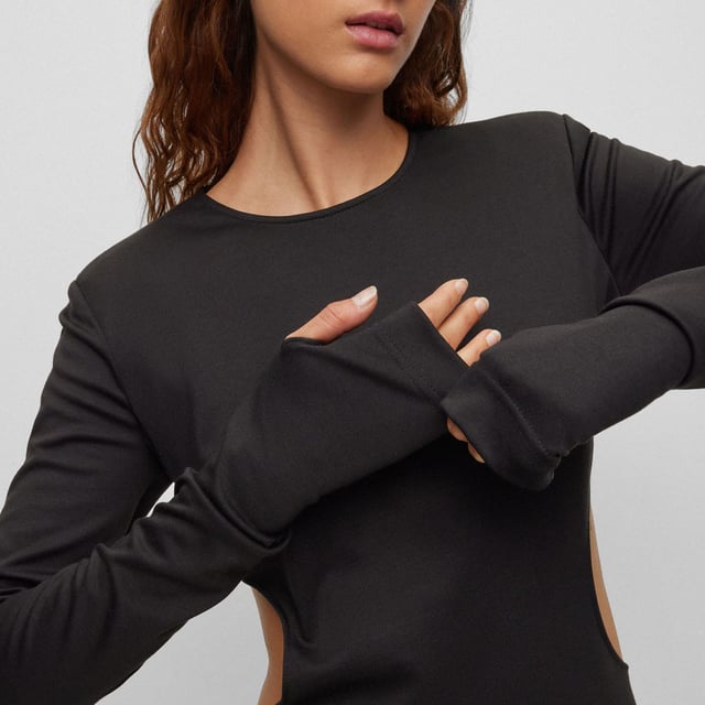 jersey dress - mini lengths - long sleeves - bodylined - nice cutouts on the side - 59% polyester  36% viscose  5% elastane.