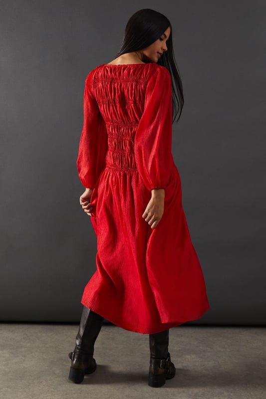 Intricate shirred bodice for a flattering fit
        Chiffon panel detailing adds texture and interest
        Elegant midi length for versatile styling
        Long sleeves with subtle volume for a romantic touch
        Slash neckline offers a sophisticated silhouette
    
    This Warehouse midi dress radiates confidence with its striking shirred bodice and chiffon panel detailing. The elegant slash neckline and long sleeves with a hint of volume create a romantic silhouette perfect for various occasions. Style this versatile piece with strappy heels and statement earrings for a wedding or formal event. For a more relaxed look, pair it with ankle boots and a leather jacket. The midi length allows for easy transition from day to night, making it an ideal choice for those who desire a dress that can adapt to different settings. Whether you're attending a graduation ceremony or heading to the races, this dress will ensure you stand out with its blend of edgy design and feminine charm.