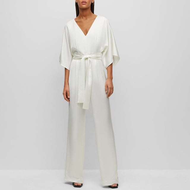 Womens HUGO Kalaisa-1 Jumpsuit in natural.- V-neckline.- Half length sleeves.- Back zipper.- Tie belt at waist.- Wide leg.- Regular fit.- 70% Recycled polyester  30% Polyester.  Dry clean.- Ref: 50490399-102