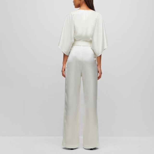 Womens HUGO Kalaisa-1 Jumpsuit in natural.- V-neckline.- Half length sleeves.- Back zipper.- Tie belt at waist.- Wide leg.- Regular fit.- 70% Recycled polyester  30% Polyester.  Dry clean.- Ref: 50490399-102