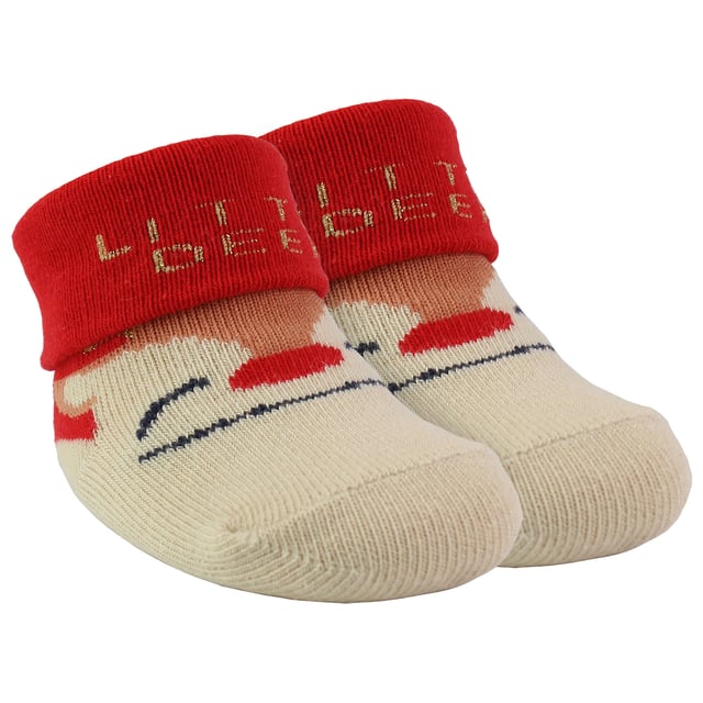 Babies Xmas Socks - First Christmas Delight: Celebrate the magic of your baby's first Christmas with these adorable and cosy baby Xmas socks! Designed to keep your little ones warm and snuggly during the festive season, these socks are both charming and practical. Each pack contains four delightfully festive patterns: Santa Claus, Penguins, Elves, and Xmas Trees, all featuring heartwarming phrases. These playful designs will bring a smile to your face and add holiday cheer to your baby's outfit. Presented in a lovely festive gift bag, these Xmas socks make an ideal gift or stocking filler. They're a thoughtful and delightful holiday treat that will be cherished and remembered. With softness and comfort at the forefront, these baby socks are made from quality materials, including 70% Cotton, 23% Polyester, 5% Elastane, and 2% Metalised Fibres. This gentle combination ensures your baby's feet remain warm and comfortable throughout the season. Plus, keeping them clean and fresh is hassle-free, as they're machine washable!. Available in two size options, 0-6 months and 6-12 months, these baby Xmas socks cater to the tiniest of feet. Make your baby's first Christmas a special and memorable one with these enchanting and cosy socks, designed to warm both their feet and your heart. Essential Product Details: - Made from premium materials for warmth and comfort - Available in two size options: 0-6 and 6-12 months