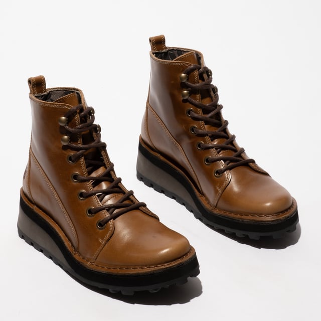 Fly London HAZI147FLY Womens Boots Camel

  
 *   Upper Material: Leather 
 *  Lining Material: Microfibre 
 *  Sole Material: Rubber 
 *  Closure/Fastening: Lace-Up 
 *  Features: Comfort 
 *  Heel Type: Wedge 
 *  Toe Shape: Round 
 *  Shoe Width: Regular 
 *  Item Weight: 0 KG 
 *  Heel Height: Low (2.5-4.9cm) 
 *  Shoe Shaft Height: Ankle 
 *  Boot Style: Ankle Boots 
 *  Gift Boxed: No  Product Code: P211147003