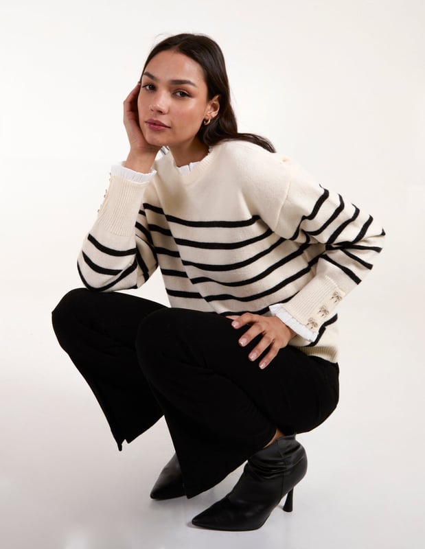 Timeless stripes and soft, cosy knit fabric make this frill neck jumper an spring time layering essential. Throw it on with flared jeans and PU black boots.