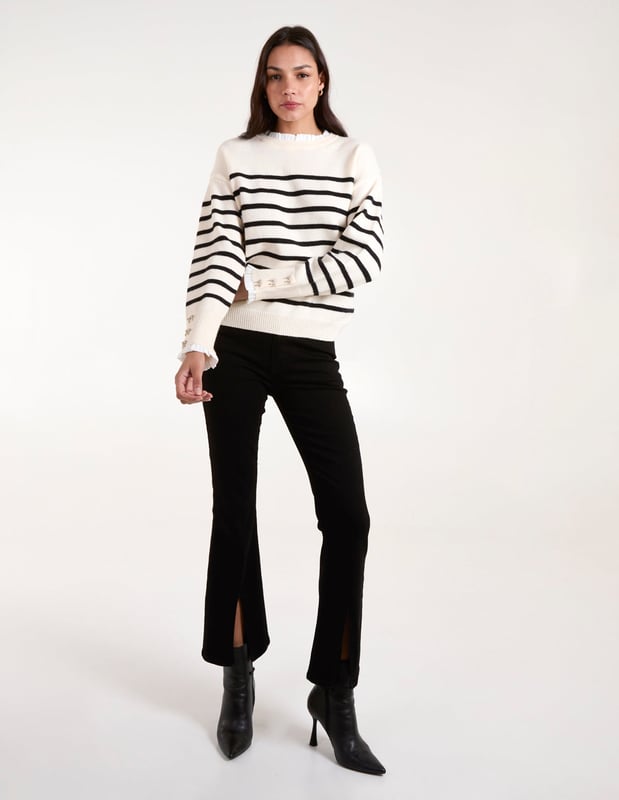 Timeless stripes and soft, cosy knit fabric make this frill neck jumper an spring time layering essential. Throw it on with flared jeans and PU black boots.