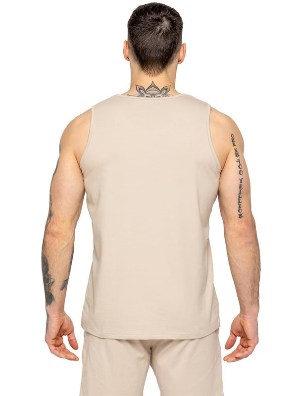 The Enzo Men's Gym Vest & Shorts Tracksuit is designed for ultimate comfort and performance. The regular-fit sleeveless vest provides a relaxed yet athletic look, with stretch material and Lycra fabric ensuring flexibility and freedom of movement. The matching gym shorts feature a regular fit and an elasticated waistband for a secure and comfortable fit. The bold Enzo Jeans branding on the chest and thigh adds a stylish, sporty touch.