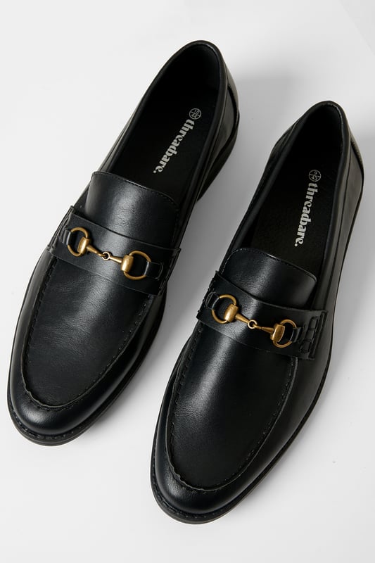 Refined elegance meets everyday comfort with these sleek snaffle loafers from Threadbare. These faux leather shoes feature a sleek slip-on design with a polished metal snaffle over the saddle. A cushioned insole offers all-day comfort, while the slight heel and durable sole add a sharp finish. Perfect for both smart and casual styling, these loafers are a versatile must-have for any modern wardrobe.